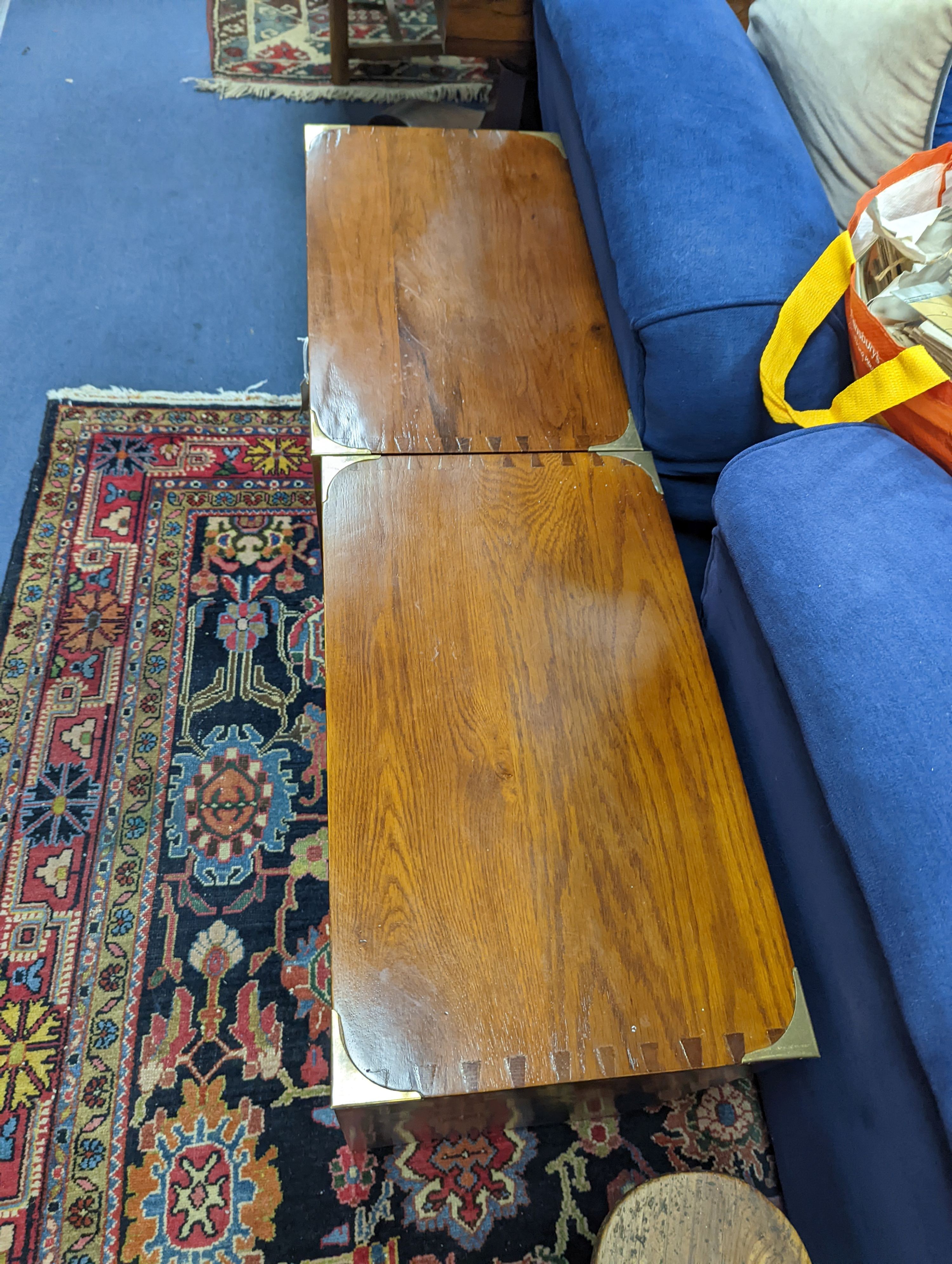 A pair of reproduction oak brass mounted military style bedside chests, width 58cm, depth 35cm, height 61cm